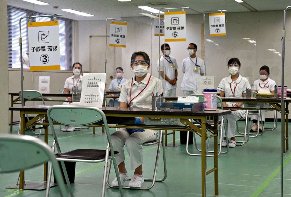 PHOTO: Nurses wait to process people arriving to receive the Moderna COVID-19 vaccine at a newly-opened mass vaccination center in Tokyo, May 24, 2021.