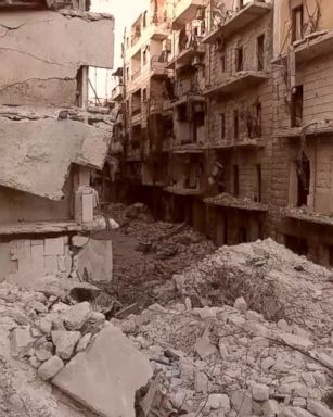 This drone video demonstrates a bird's-eye view of homes and buildings in Aleppo city destroyed by airstrikes and bombings carried out by Syrian regime forces.