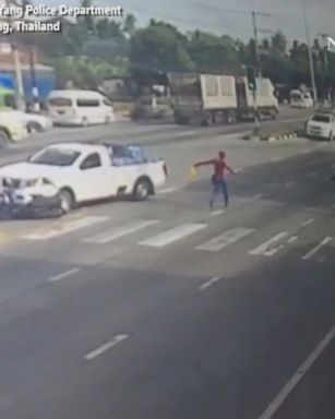 A street vendor dressed up as Spider-Man sprang into action to rescue an injured motorcyclist who was hit by a pickup truck.