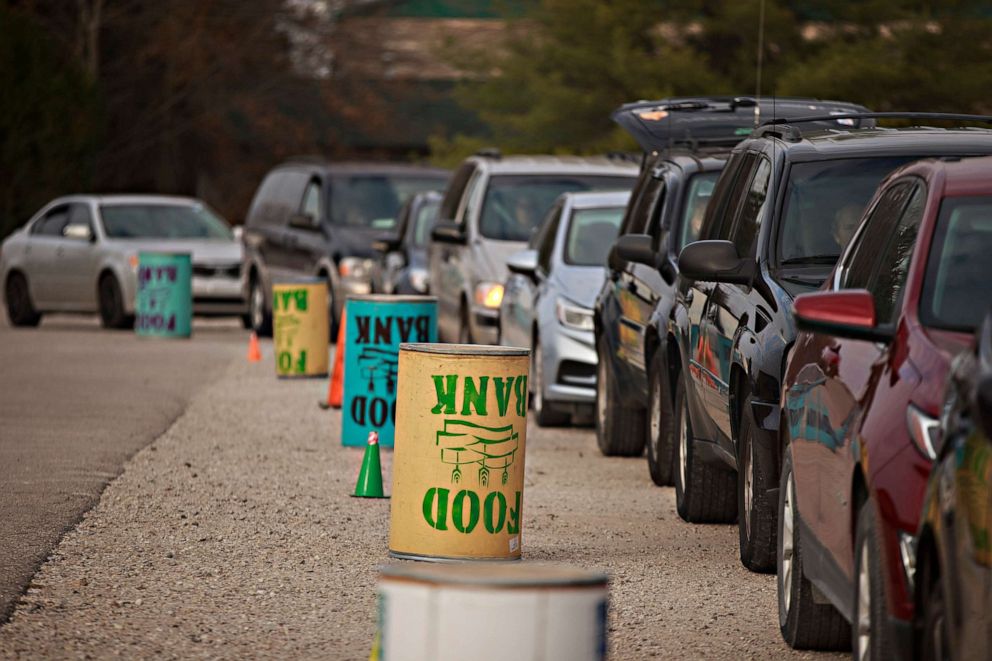 PHOTO: Drivers wait in line up as Pantry 279 food bank to distributes Thanksgiving meals at Hoosier Hills food bank in Bloomington, Indiana, Nov. 11,2020.