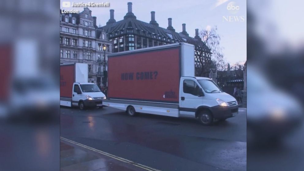 VIDEO: Three large billboards pulled by vans snaked through the British capital carrying a stark, sequential message: "71 dead" "And still no arrests?" "How come?"