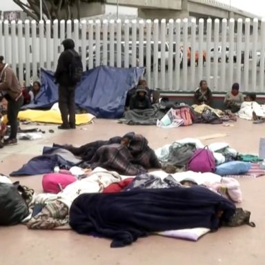 VIDEO: Organizers of the group told ABC News that there are about 100 people sleeping outside a port of entry in San Diego.