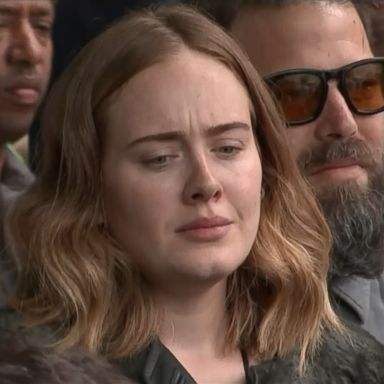 After a national moment of silence, cameras caught Adele singing along to a gospel choir's rendition of "Lean On Me."