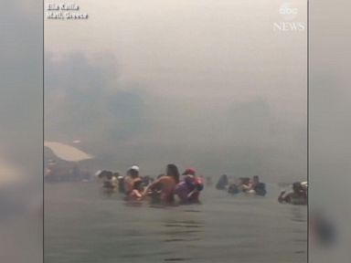 WATCH: People flee into sea to escape Greek wildfires