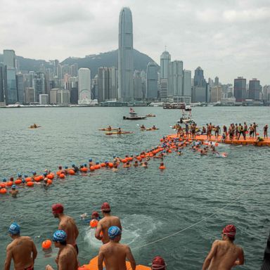 VIDEO: Swimmers compete in Hong Kong, migrant toddler laughs: World in Photos, Oct. 26