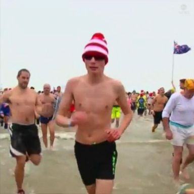 VIDEO: Thousands of Belgians, dressed in costumes and bathing suits, took a dip in the frigid waters of the North Sea to ring in the new year! 