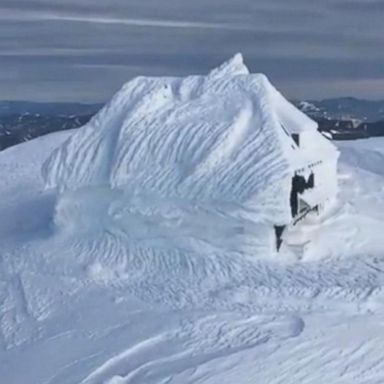 VIDEO: Stunning footage shows a structure completely covered by snow in Austria following weeks of heavy snowfall in the region.