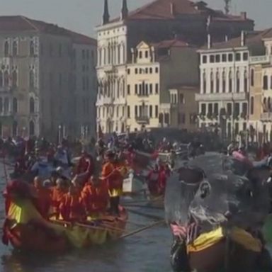 VIDEO: Thousands of people lined the iconic canals of Venice to watch as hundreds of gondolas floated through the lagoon for the annual Venice Carnival Water Parade.