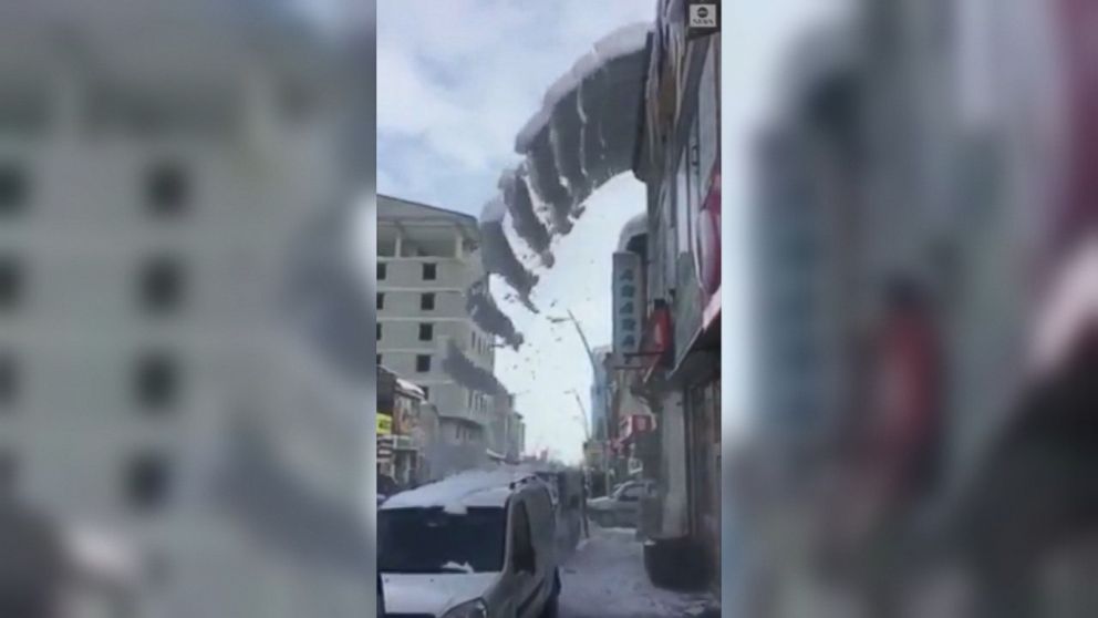 VIDEO: Slabs of snow fell from the rooftop of a butcher shop in Turkey, creating a mesmerizing display.