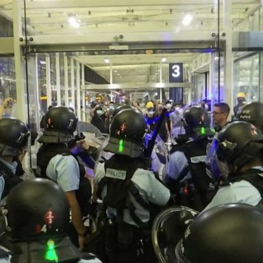 Hong Kong International Airport canceled all flights for the second straight day Tuesday as crowds of anti-government protesters continued to occupy the terminals and clashed with police.