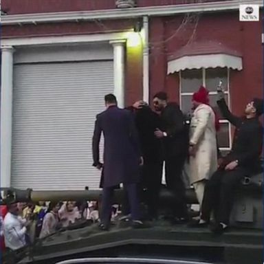 Guests were shocked as the tank arrived to the wedding at the Bolton Excellency Centre in England. 