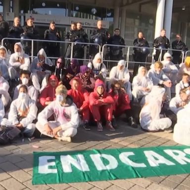 Thousands of climate-change activists formed a human roadblock on Sunday to the Frankfurt auto show, one of the largest car industry showcases in the world.