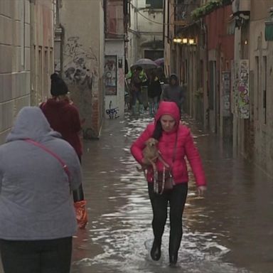 Residents and tourists waded through the water, which has caused inestimable damage to the centuries-old Italian city.