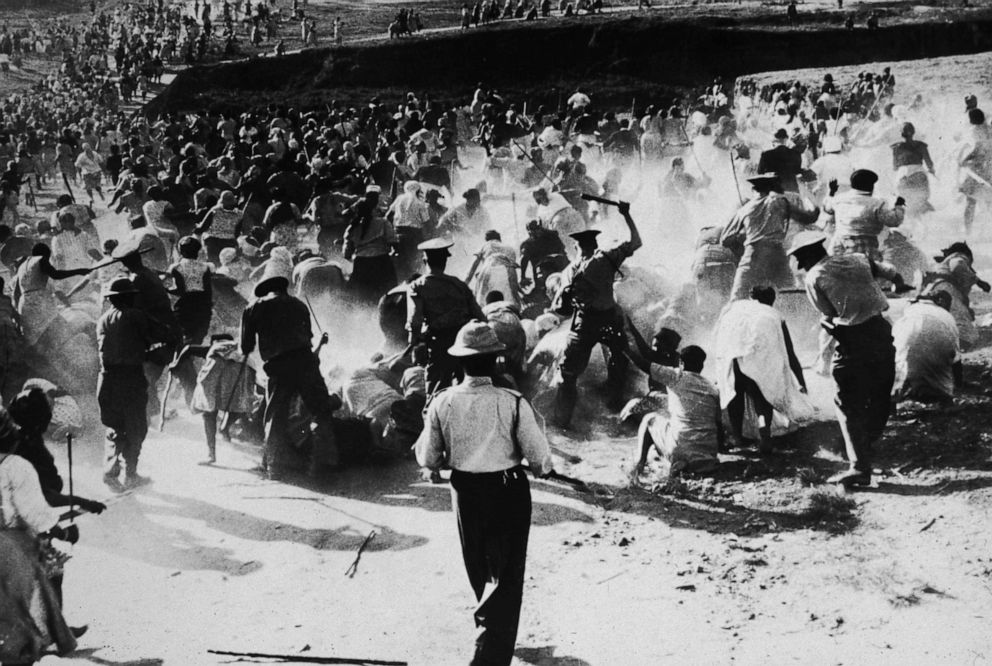 PHOTO: South African police beat black women with clubs after anti-apartheid protesters raided and set a beer hall on fire in Durban, South Africa in 1959.
