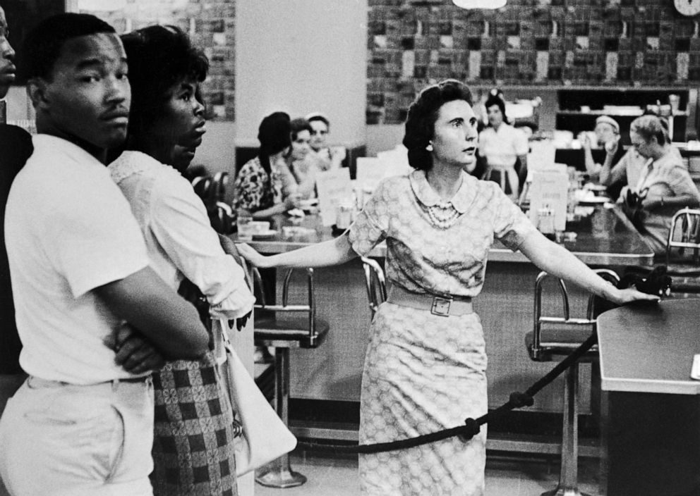 PHOTO: A woman bars the way as a group of African Americans were about to enter the lunch counter of a department store in Memphis to protest the segregation policy of the establishment, June 9, 1961.