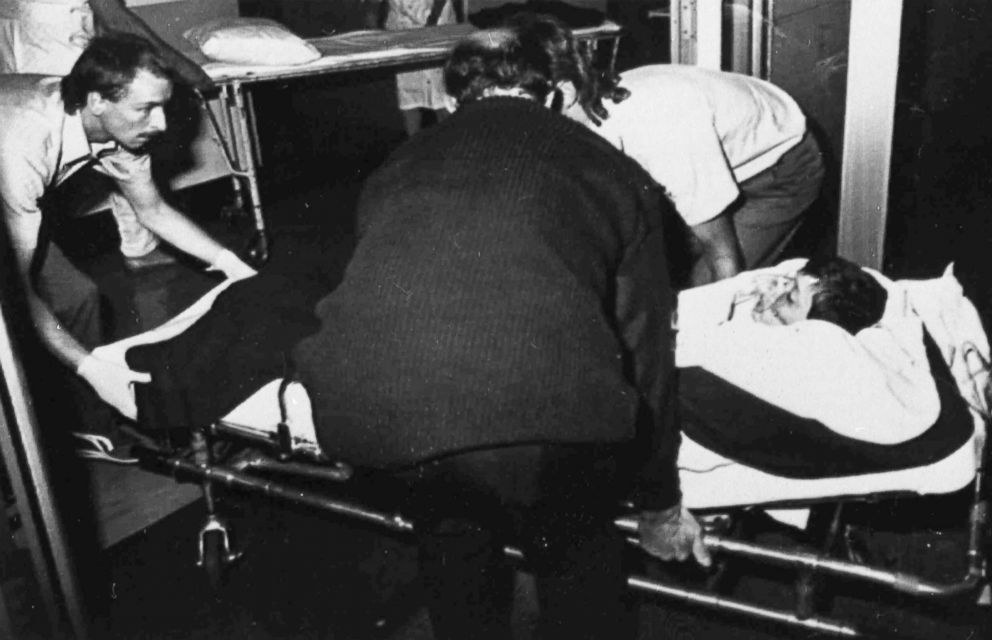 PHOTO: Ambulance officers transfer a boy to Dunedin Public Hospital, New Zealand, Nov. 14, 1990, after he had been shot in Aramoana. David Gray went on a rampage, killing 12 people, including four children and a police officer.