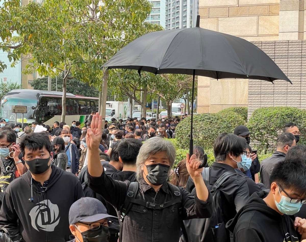 PHOTO: Some of the supporters outside court held up a three-finger Hunger Games salute, which is also used as symbol of resistance in Myanmar and Thailand.