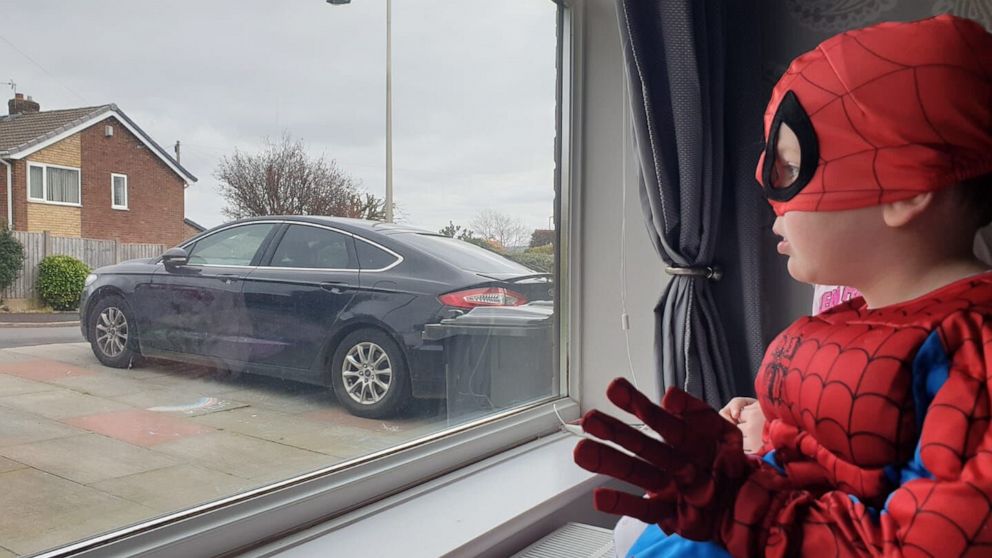 PHOTO: With the United Kingdom mired in the second week of an unprecedented lockdown over the COVID-19 outbreak, Andrew Baldock and Jason Baird in Stockport, England, had an idea to run around as Spider-Man to cheer up children stuck indoors.