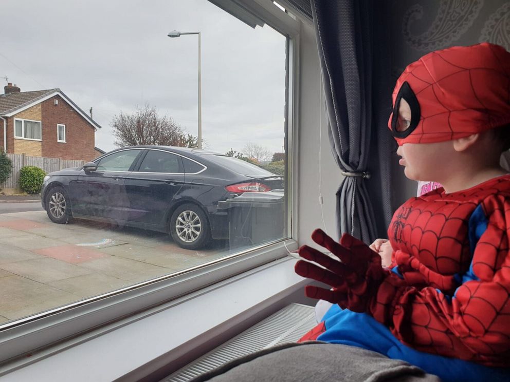 PHOTO: With the United Kingdom mired in the second week of an unprecedented lockdown over the COVID-19 outbreak, Andrew Baldock and Jason Baird in Stockport, England, had an idea to run around as Spider-Man to cheer up children stuck indoors.