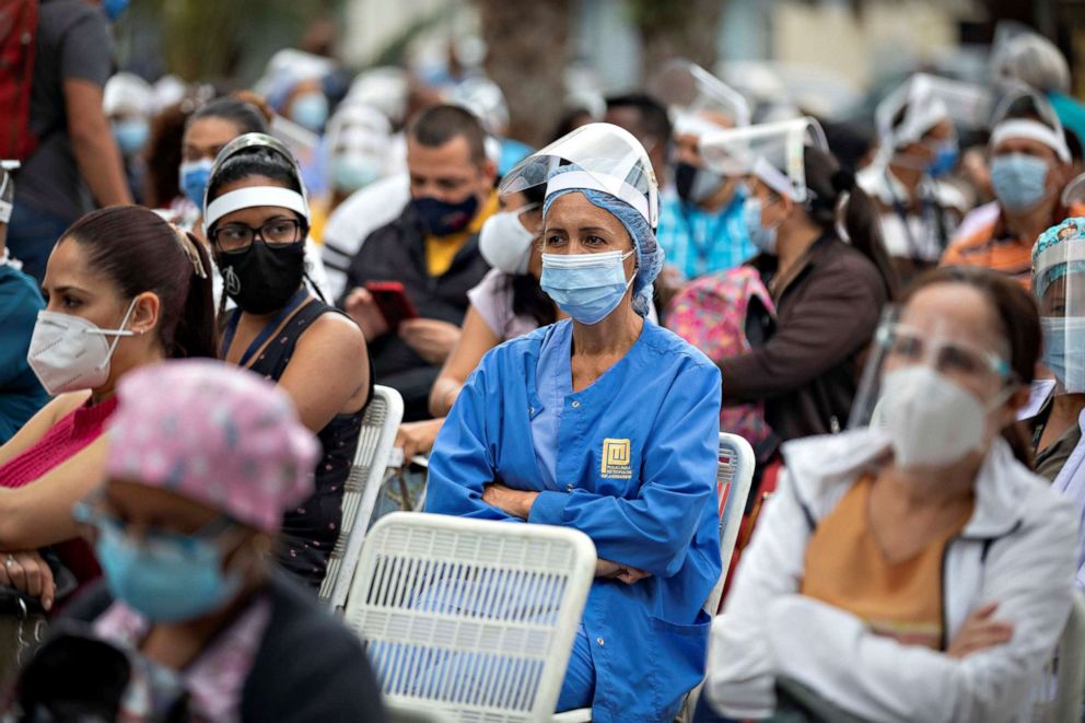 PHOTO: Medical workers in Caracas, Venezuela wait to be vaccinated with the Chinese Vero Celll vaccine against COVID-19 in the Municipal Council of Baruta, May 28, 2021.