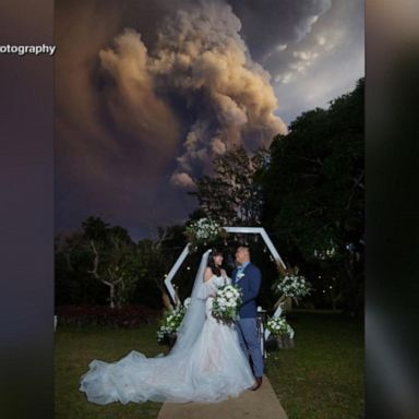 While tens of thousands of people have been evacuated in the Philippines, a nearby wedding went on as planned. 