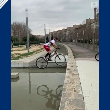 VIDEO: Spanish cyclist hops across fountain on bike