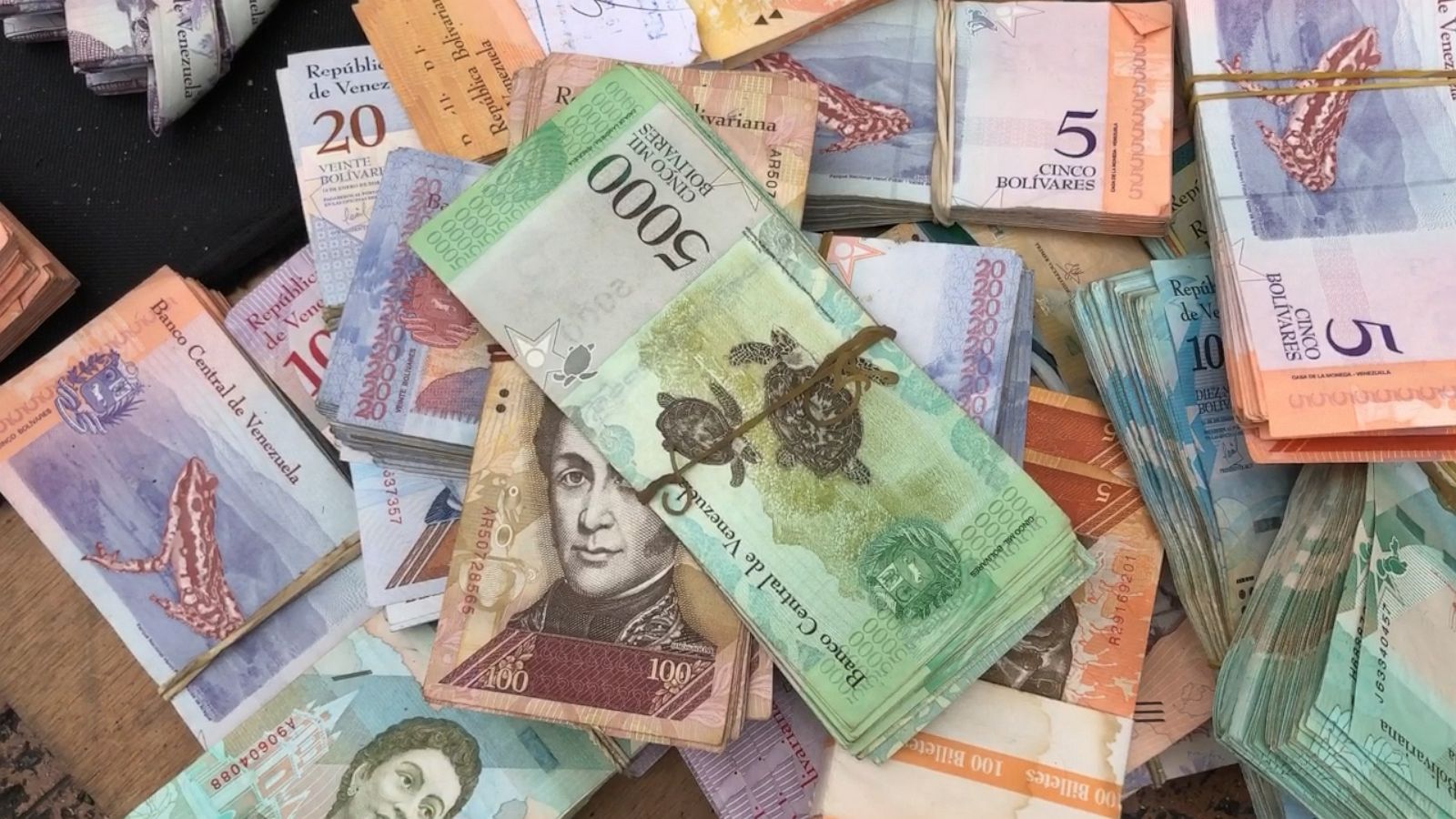 Devalued Venezuelan currency artfully sold on Bogota streets - Good ...