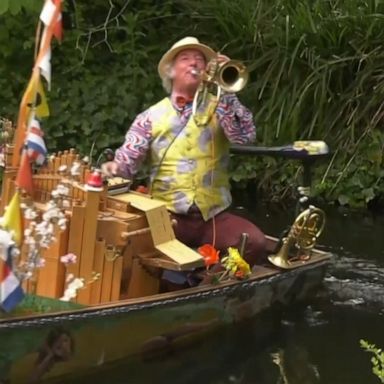  A Dutch boat troubadour played for elderly residents from a pond outside their senior care home as coronavirus restrictions reined in King's Day festivities on the canals of Amsterdam.