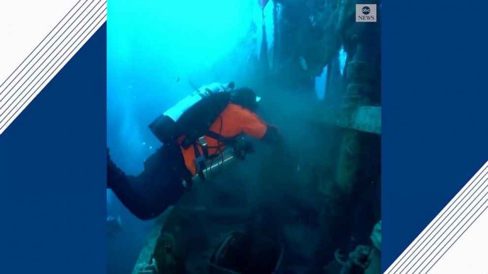 Divers remove lost fishing nets from submarine wreck in Greece