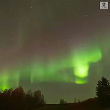 A photographer captured footage of the aurora borealis illuminating the night sky above Norway.