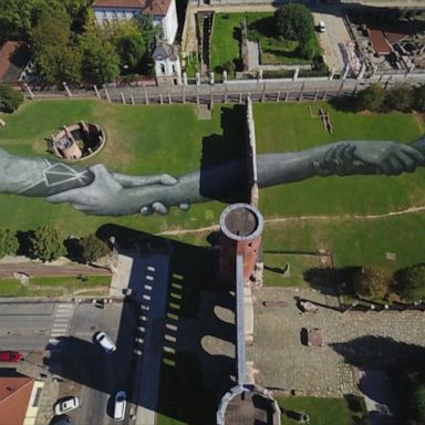 Drone flies over giant human chain