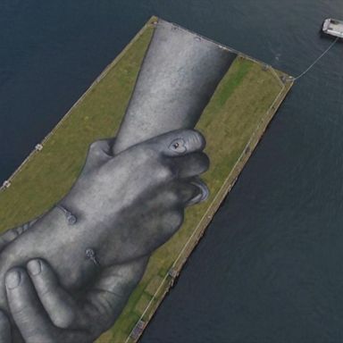 Drone footage shows gigantic floating hands