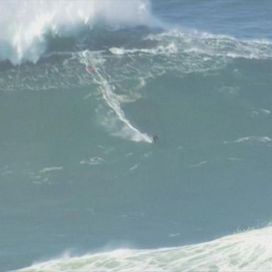 Surfers ride huge waves in Nazare