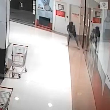 Australian police released a surveillance video of the man smashing the post office's glass door and taking cellphones inside.