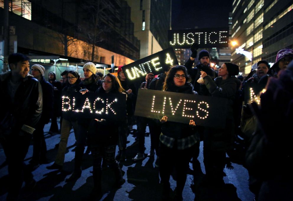 PHOTO: Marchers approach the West Side Highway after a Grand Jury decided not to indict the police officer who placed Eric Garner in a chokehold, Dec. 4, 2014, in New York.