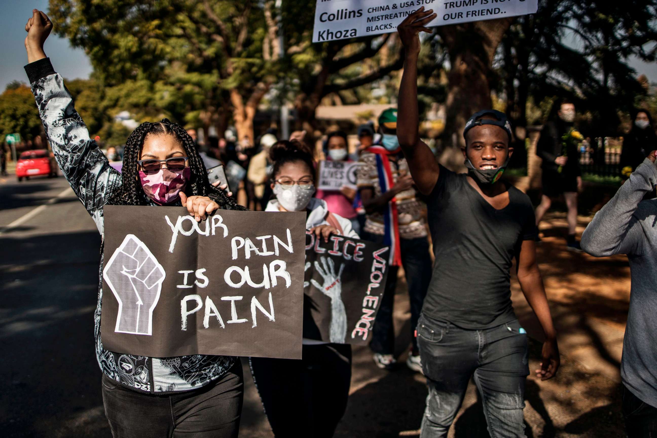 PHOTO: Activists hold placards as they march from the U.S. Embassy in Pretoria, South Africa, during a protest against the death of George Floyd, June 6, 2020.