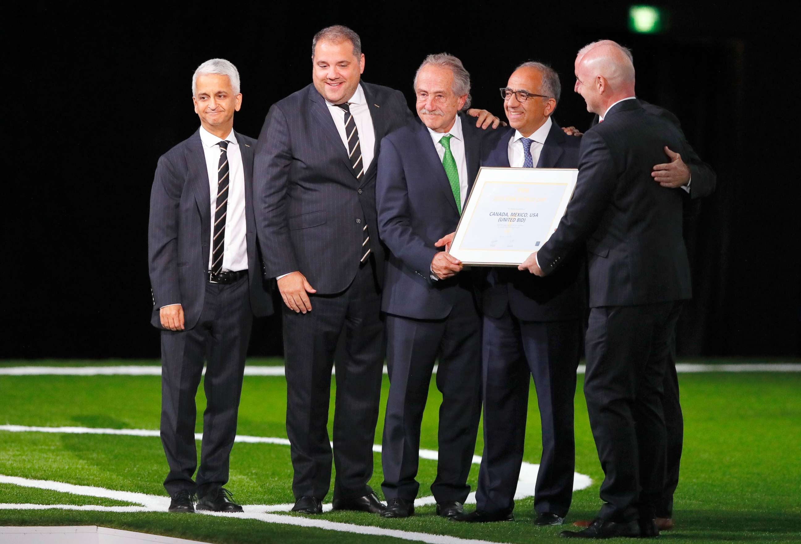 PHOTO: FIFA president Gianni Infantino (r) poses with the United 2026 bid (Canada, Mexico, US) officials for the 2026 FIFA World Cup went to United 2026 bid during the 68th FIFA Congress at Moscow's Expocentre, June 13, 2018, in Moscow.