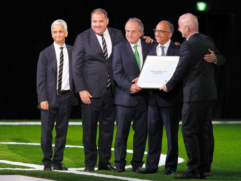 PHOTO: FIFA president Gianni Infantino (r) poses with the United 2026 bid (Canada, Mexico, US) officials for the 2026 FIFA World Cup went to United 2026 bid during the 68th FIFA Congress at Moscows Expocentre, June 13, 2018, in Moscow.