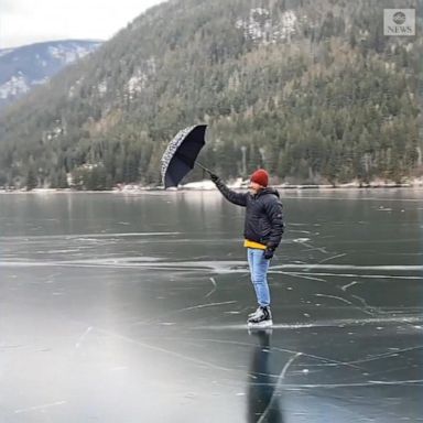 VIDEO: Ice skater glides ‘Mary Poppins’-style across frozen lake