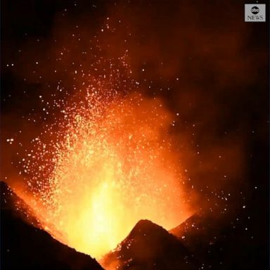 Spectacular close-up footage of Italy's Mount Etna volcano spewing molten lava was captured during an explosion.