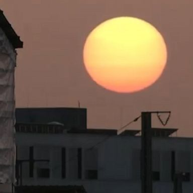 A plume of desert dust lights up the skies with a pink and red glow in Munich and Stuttgart, Germany.