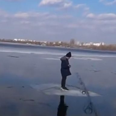 A Ukrainian man used his fishing rod to pull a boy to safety after the child got stranded on a floating block of ice in the middle of a river.