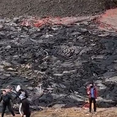 A group spent a Saturday playing volleyball as Iceland's Fagradalsfjall volcano erupted in the background.