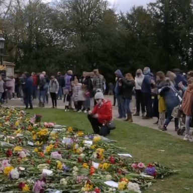 Mourners left notes, cards and flowers outside the gates of Windsor Castle in honor of Prince Philip, who died Friday at the age of 99.