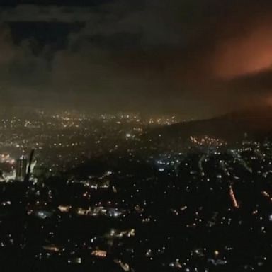 A large fire spread on the slopes of the city’s famed Table Mountain, setting several university buildings ablaze, including a nearly 200-year-old library.