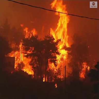 Firefighters and residents continued to battle a massive forest fire on Greece’s second largest island.