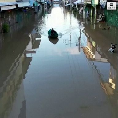 Waist-high floodwaters caused havoc in northern Thailand, as Bangkok braces for possible flooding.