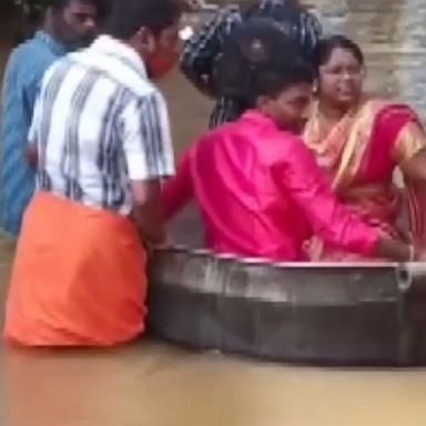 This bride and groom got inside a giant cooking pot and floated down a flooded road to their wedding ceremony.