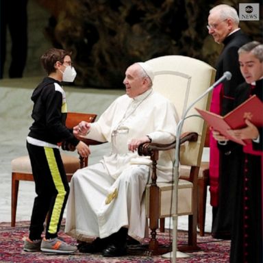 A young boy wandered onto the stage during the Pope's general audience and asked for his white papal cap. 