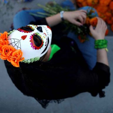 VIDEO: Day of the Dead, All Saints Day, train derailment: World in Photos, Nov. 1